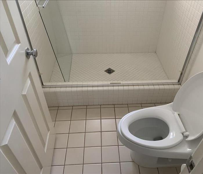 Bathroom with white tile before the reconstruction.