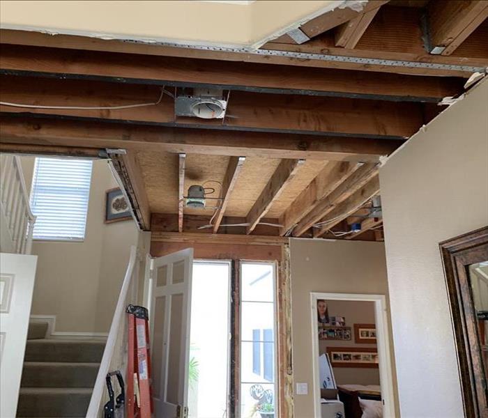 A demoed ceiling near the entryway of an Irvine, CA home. 